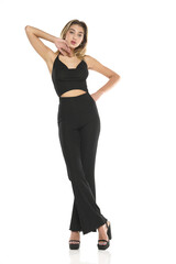 a young woman in blask wide trousers and bra posing on a white background © vladimirfloyd