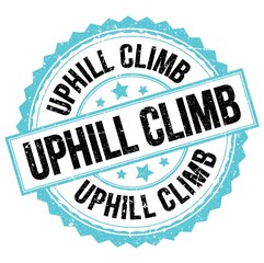 UPHILL CLIMB text on blue-black round stamp sign