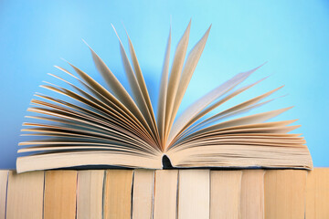 Collection of books on light blue background