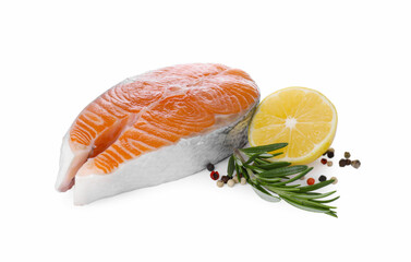 Fresh raw salmon steak with rosemary, peppercorns and lemon on white background