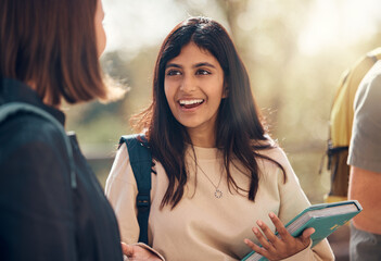 Happy, university and woman student from India laughing and talking about a test. College, book and happy woman speaking to campus students about education, learning and school studying with a smile