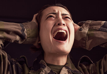 PTSD, crying and trauma with a woman soldier shouting or screaming in studio on a dark background....