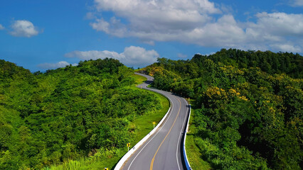 The highway stairs to the sky of road trough with green forest  as the nature landscape background
