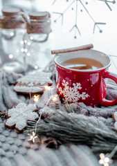 Winter tea in the christmas red mug - obrazy, fototapety, plakaty