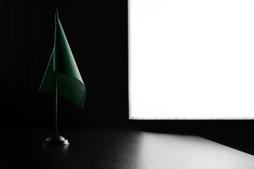 Small national flag of the Bangladesh on a black background