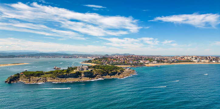 Magdalena Palace in Santander Spain with aerial view of the peninsula and the city with sunny beach in summer.	