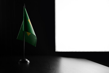 Small national flag of the Brazil on a black background