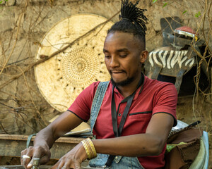 man concentrating on metalwork