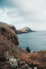 Fototapeta na wymiar a large body of water surrounded by mountains on madeira
