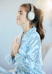 Headphones, prayer or woman in meditation in bedroom streaming relaxing zen music, yoga podcast or...