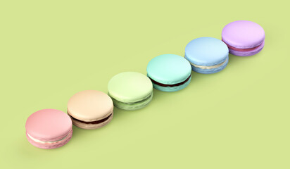 Six french macarons with different colors and flavors on green background