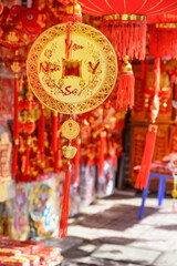 Fototapeta na wymiar Red and gilded decorations at Lunar New Year market, Vietnam