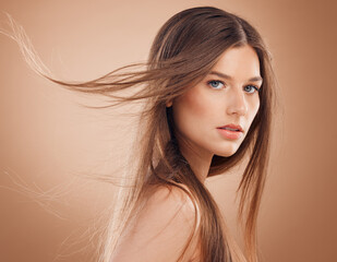Woman, face glow or windy hair on studio background in keratin treatment, dermatology health, care...