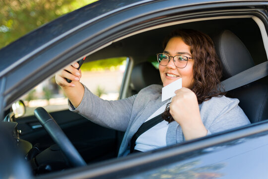 Cheerful obese woman getting her driver's license