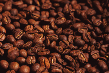 Brown background fresh arabica coffee beans for espresso