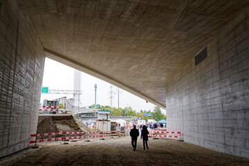 Open day at highway enclosure construction site with concrete ceiling of ramp with visitors at...