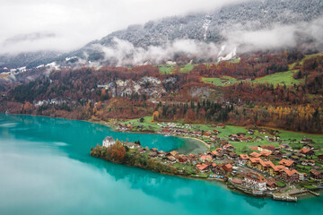 Aerial view, Iseltwald village with idyllic nature scenery of lake Brienz with turquoise waters. Switzerland