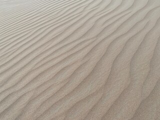 desert and sand waves and ripple background photo