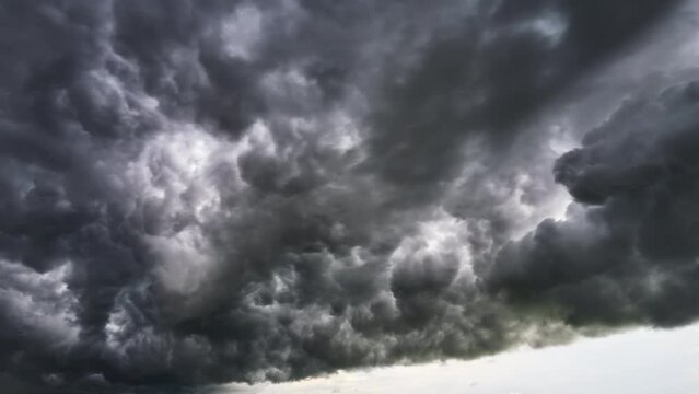 Landscape of dark ominous clouds like volcano eruption on stormy sky during heavy thunderstorm
