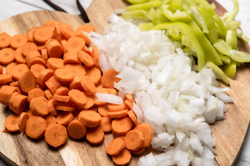 Chopped fresh peppers, onions, carrots. Vegetarianism concept. Mix of vegetables.