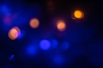 Defocused Lights and Dust Particles over Black Background