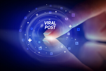 Finger touching tablet with social media icons concept