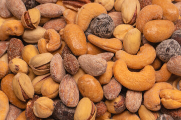  A group of almonds, pistachios, walnuts, macadamia, cashews.