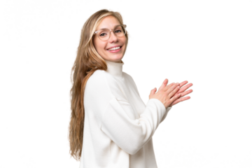 Young blonde woman over isolated background applauding