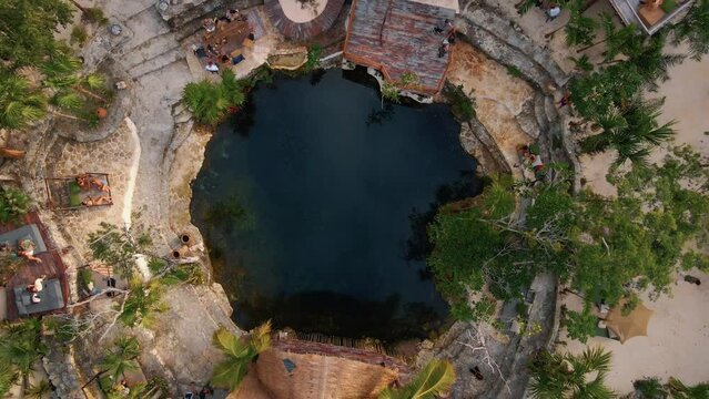 Drone shot of Vesica Cenote Tulum, Mexico. forest Secret natural pool.