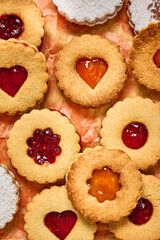 Traditional homemade linzer cookies. Almond flour cookies with raspberry and apricot jam.