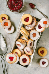Traditional homemade linzer cookies. Almond flour cookies with raspberry and apricot jam.