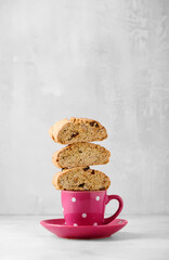 Traditional  Italian Tuscany double baked cookies. Cantuccini, cantucci, biscotti with almonds. Tasty and delicious baked treats on coffee cup.
