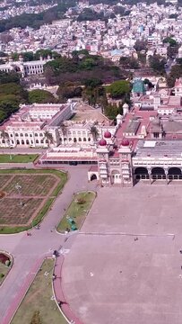 Vertical video of Aerial shot of Mysore palace and its surroundings at early morning