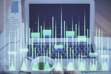 Forex Chart hologram on table with computer background. Double exposure. Concept of financial markets.