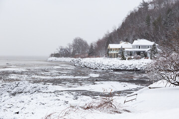 A scattering of houses on the St. Lawrence River coastline in the Cap-Rouge area seen during a...