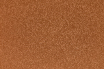 The texture and background of the leatherette is brown. Leatherette pattern texture as background and design element. Leather background for design development