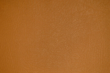 The texture and background of the leatherette is light brown. Leatherette pattern texture as background and design element. Leather background for design development