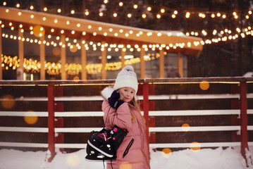 girl with skates on the rink
