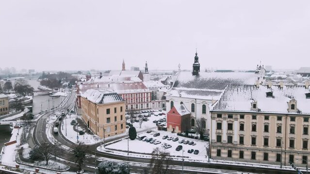 Winter aerial view with snowfall on Parish of the Most Holy Name of Jesus in the center of city 4k