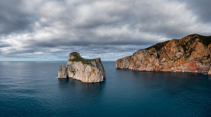 panorama landscape of the cliffs and sea stacks at Porto Flavia on Sardinia