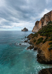 vertical landscape of the cliffs and sea stacks at Porto Flavia on Sardinia