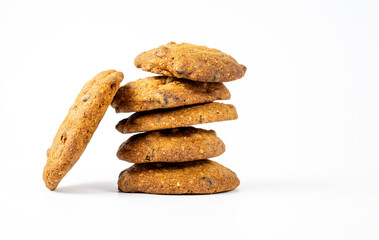 Fototapeta na wymiar stack of home made irregular shaped cocnut and chocolate chip cookies isolated on a white background