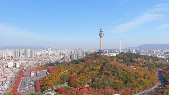 Daegu: Aerial view of Metropolitan City in South Korea, Duryu Park in autumn colors, sunny day - landscape panorama of Eastern Asia from above