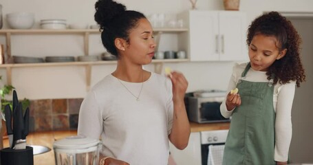 Fruit, mother and girl cooking breakfast or healthy food or tasting in meal preparation in home kitchen. Banana, strawberry or mom teaching a happy kid for growth or child development as a family