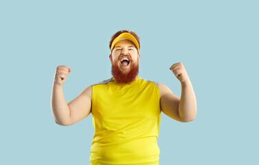 Cheerful crazy funny bearded fat man shouts loudly rejoicing in victory of his favorite sports...