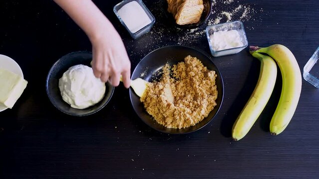 Cooking Banoffi cake at home in the kitchen, pastry recipe.
