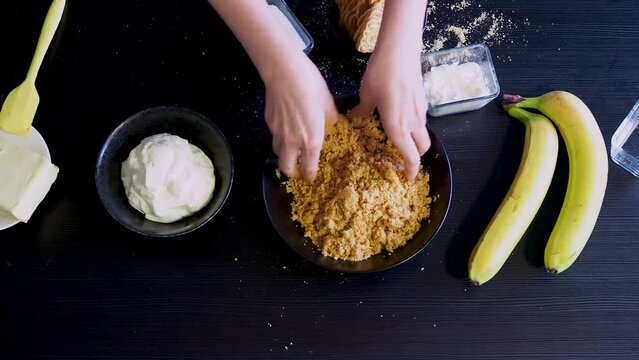 Cooking Banoffi cake at home in the kitchen, pastry recipe.