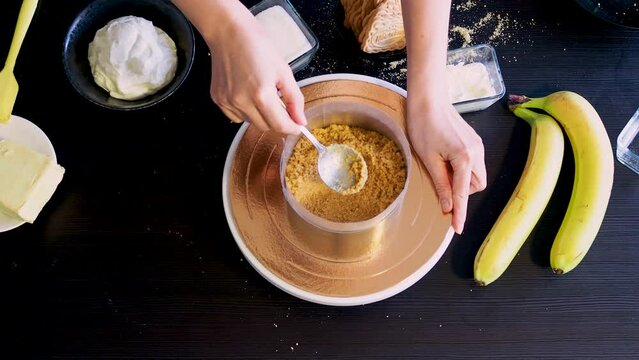 Cooking Banoffi cake at home in the kitchen, pastry recipe.