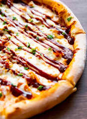 Pizza with chicken, cheese and barbeque sauce.