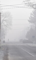 Fog inside the village at winter.